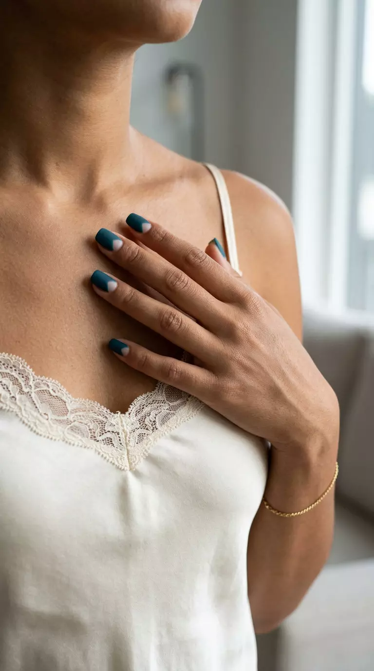 Matte Teal Nails 2026: Negative Space Edge Modern matte deep teal negative space nails for summer matte nails 2026. Edgy party style.
