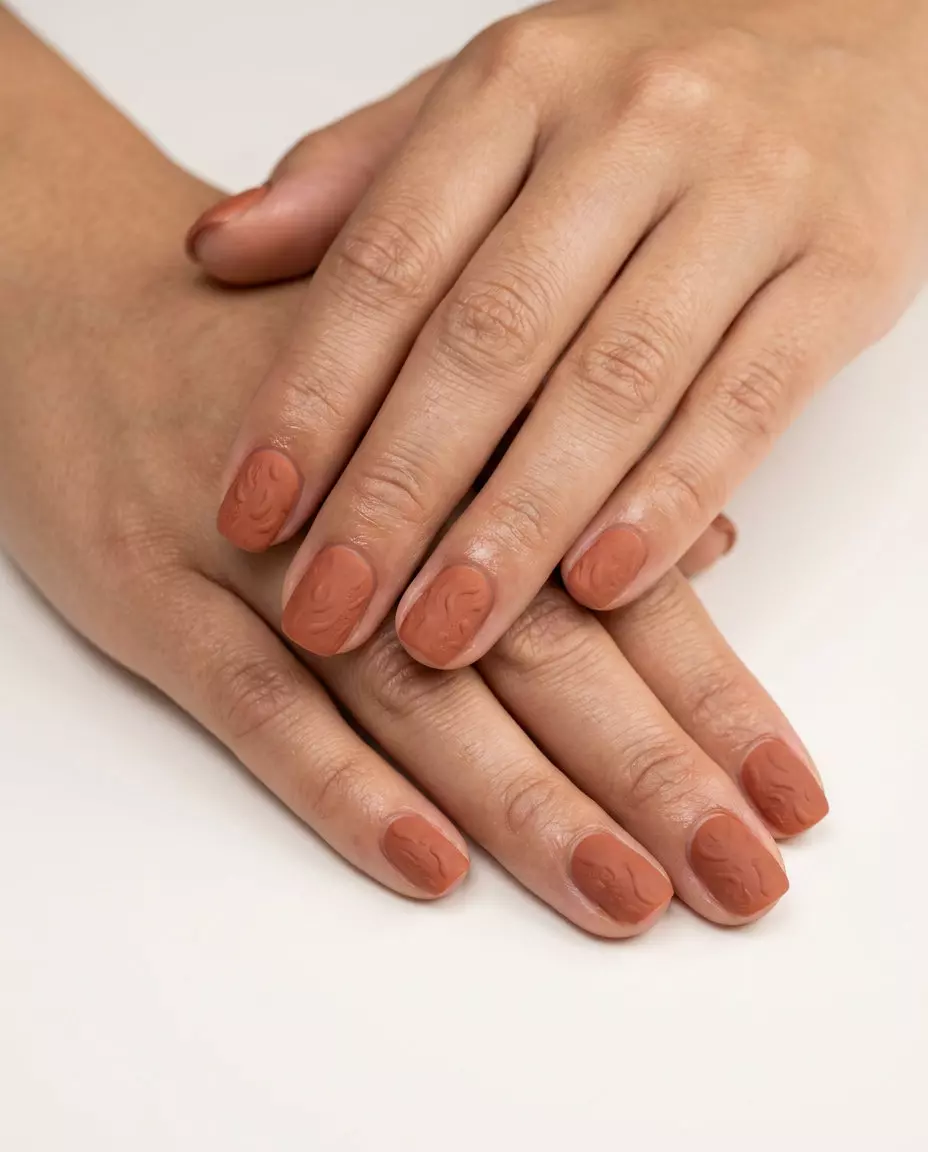 Matte Terracotta Nails 2026: Textured Earth Matte terracotta textured nails for summer matte nails 2026. Earthy brown-orange with subtle raised design.