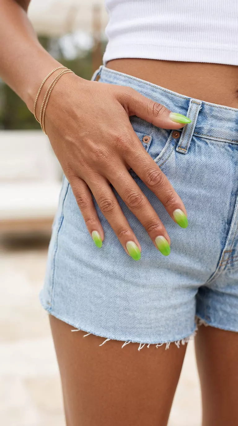 Lime green jelly gradient nails for summer nail art 2026. Juicy, translucent effect on medium oval nails.