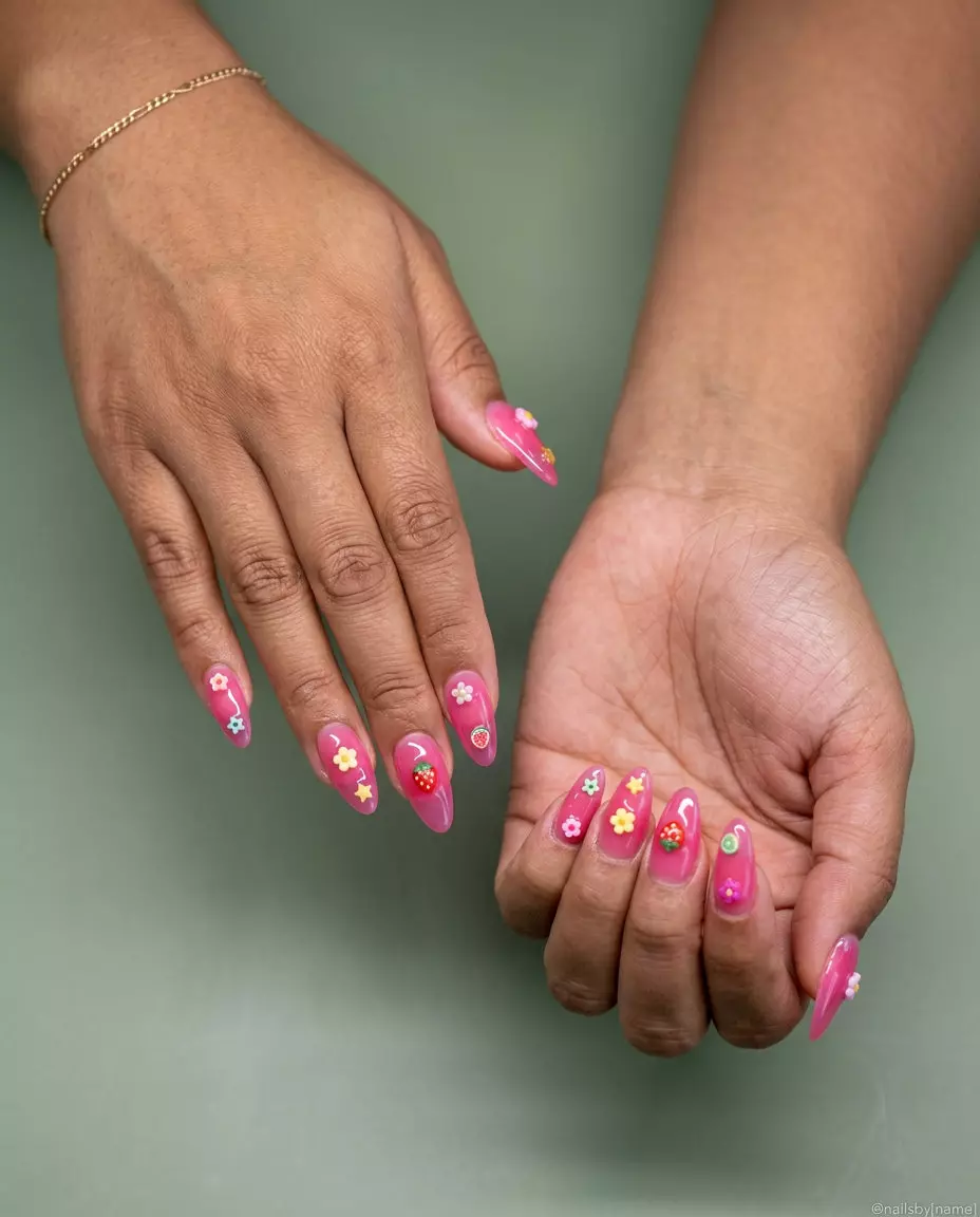 Jelly pink charm pop nails for summer 2026. Whimsical, playful festival style.