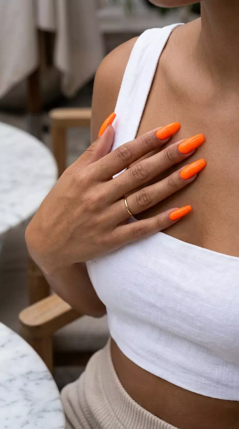 Screaming Neon Orange Burst: Bold summer nail colors 2026 for festivals. Electric neon orange.