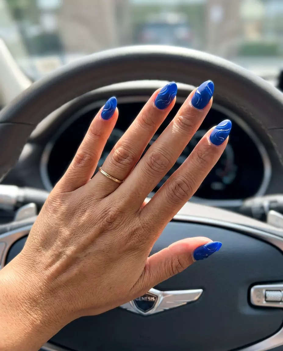 Cobalt Textured Swirl Sophistication nails for summer nails 2026: deep blue with raised abstract swirls.
