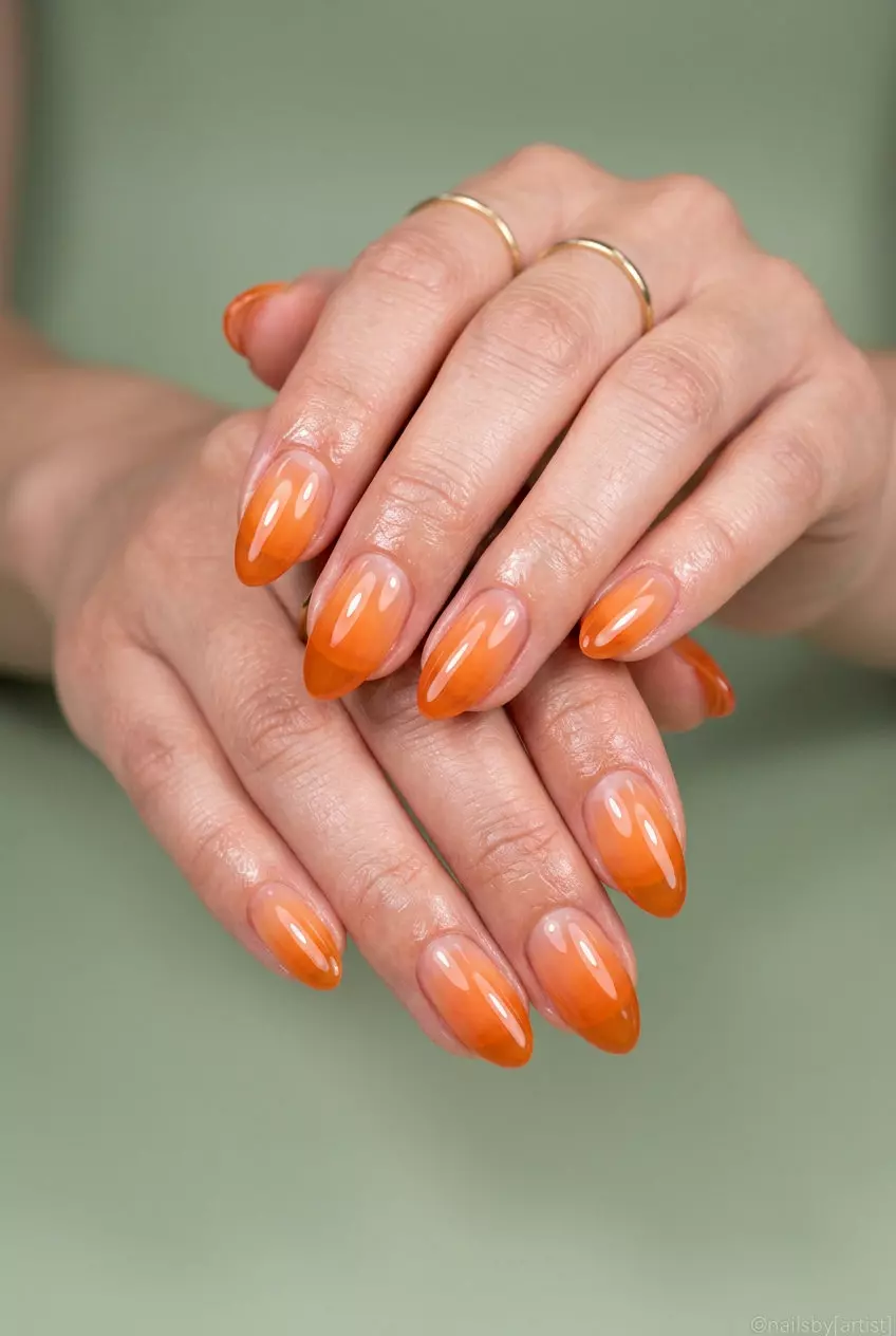 Peach Ombre Jelly Sunset nails for summer nails 2026: sheer peach to soft orange on long almond nails.