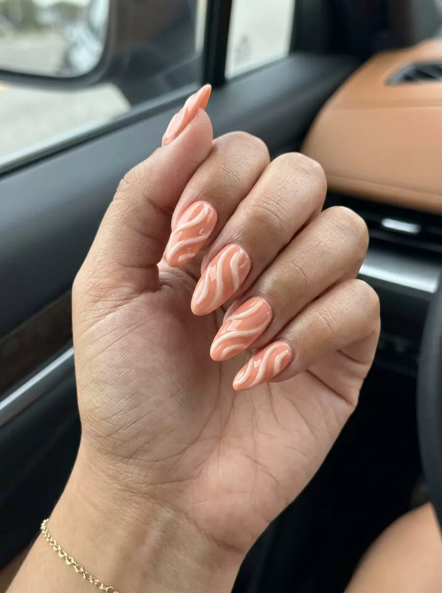 Textured coral swirl summer nails 2026 for festival and vacation. Bohemian style with 3D art.