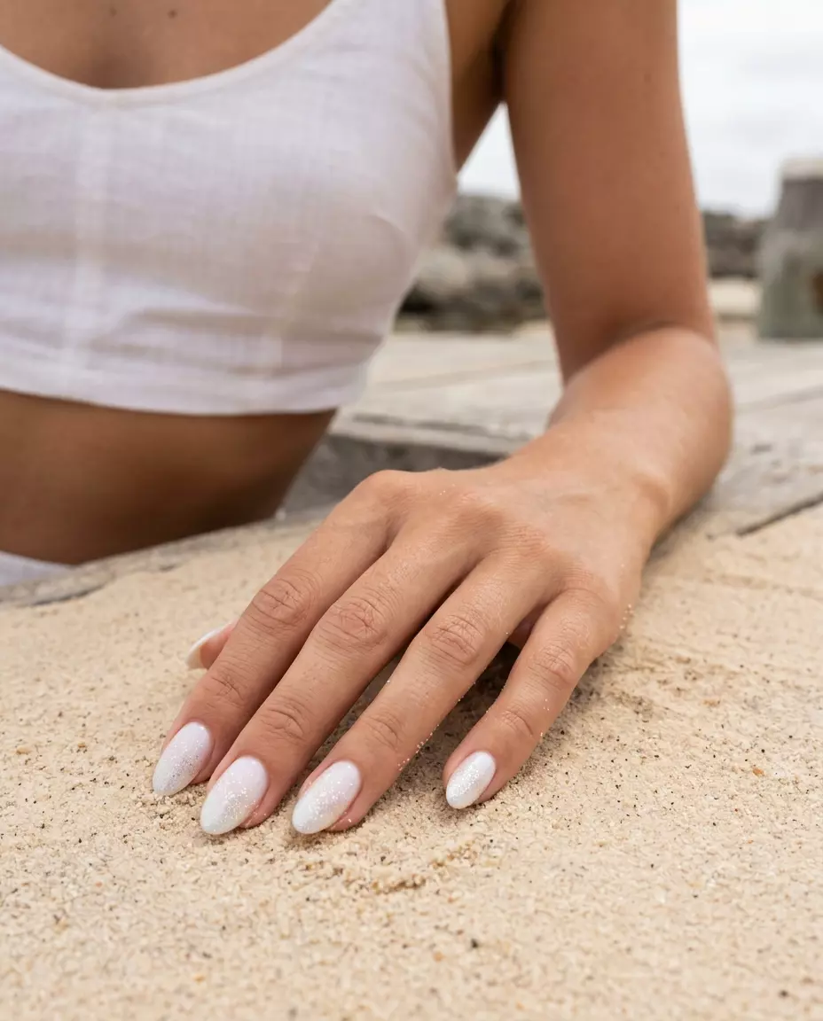 Seafoam Sparkle Gradient Nails 2026 Seafoam Sparkle Gradient nails for summer nails beach vibes 2026. Romantic sheer white with iridescent glitter for weddings.