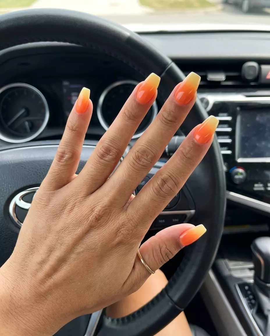 Sunset Orange Ombre Coffin Nails 2026 Sunset orange to yellow ombre coffin nails for summer nails beach vibes 2026, perfect for vacation or festivals.
