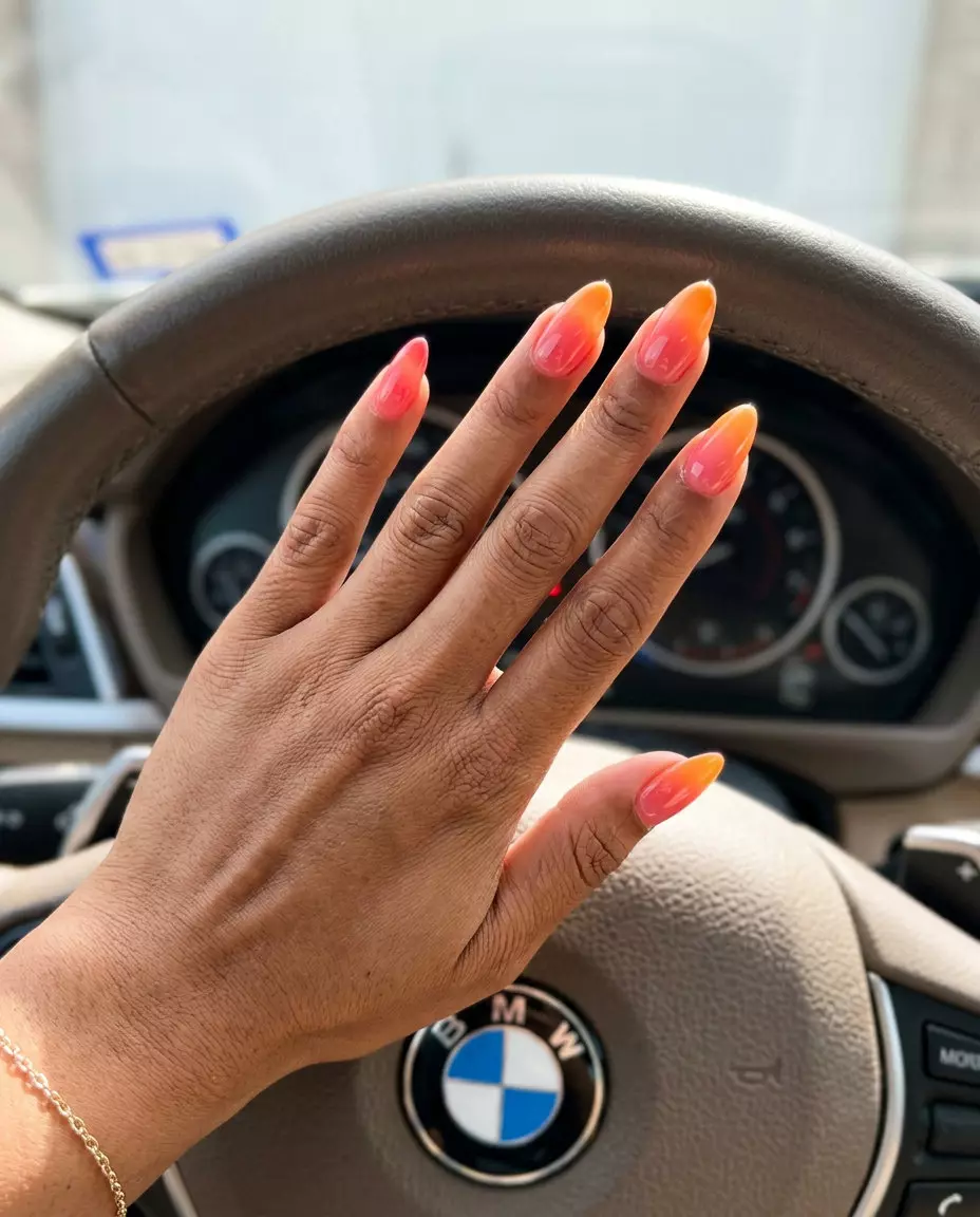 Sunset Ombre Nails 2026 Sunset ombre nails in coral pink and bright orange for summer 2026, ideal for beach parties.