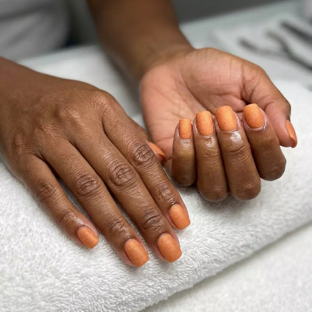 Sunstone Orange Shimmer Nails 2026 | Bohemian Festival Sunstone orange sandy shimmer nails for summer nails for brown skin tone 2026. Bohemian & warm, great for festivals.