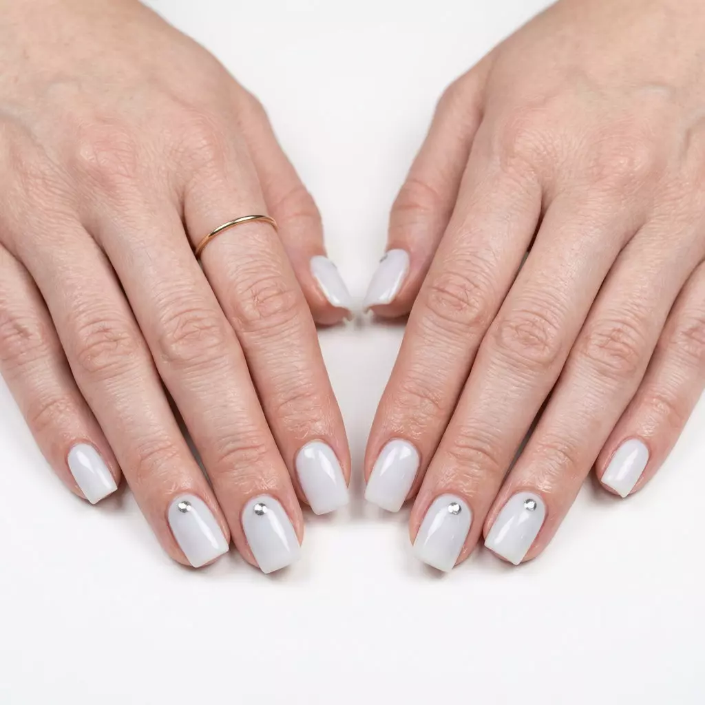 Milky White Chrome Dot Almond Nails 2026 Milky White Chrome Dot Almond nails: Milky white with silver chrome dots for a minimalist, futuristic look for summer nails for pale skin 2026.