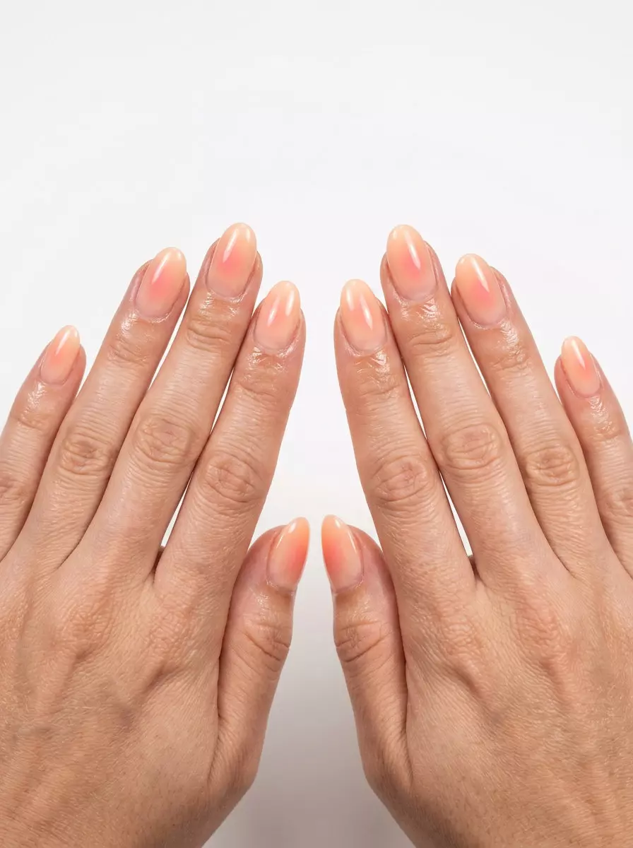 Sun-Kissed Peach Aura Sheer Nails 2026 Sun-Kissed Peach Aura Sheer nails: Sheer pale peach with diffused pink/orange gradient for summer nails for pale skin 2026.
