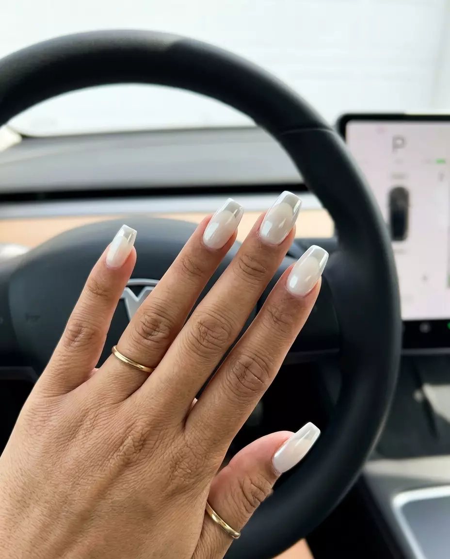Futuristic Chrome White Flare French nails with opaque milky white base and mirrored chrome tip. Ideal for parties.