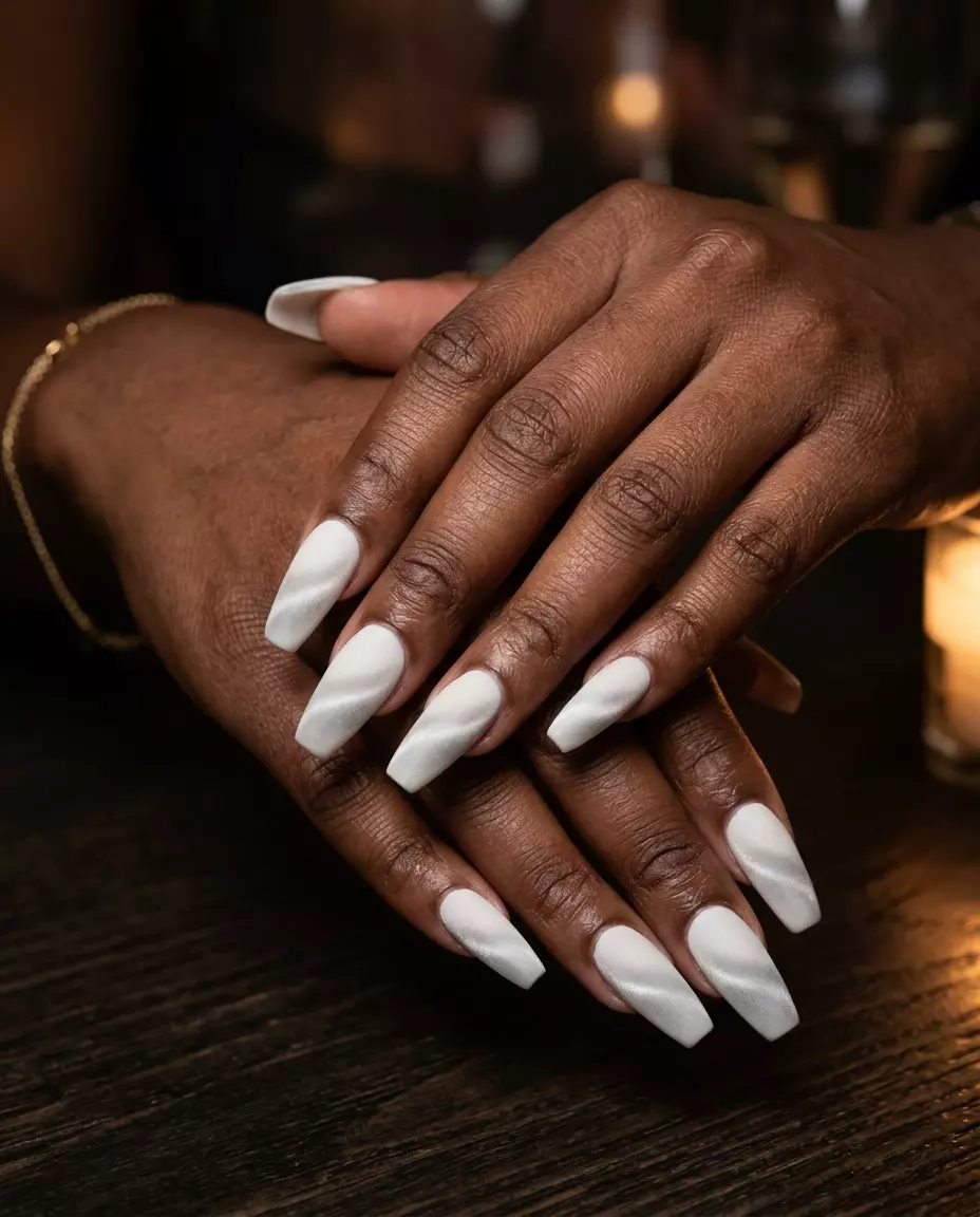 Milky white velvet cat-eye nails for evening events. Sophisticated, luxurious, mysterious summer nails milky white 2026.