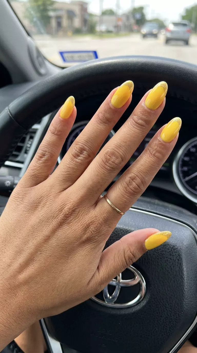 Glitter Mustard French Tip Nails 2026 Glamorous glitter mustard yellow French tip nails for summer 2026. Festive, bold style for celebrations and weddings.