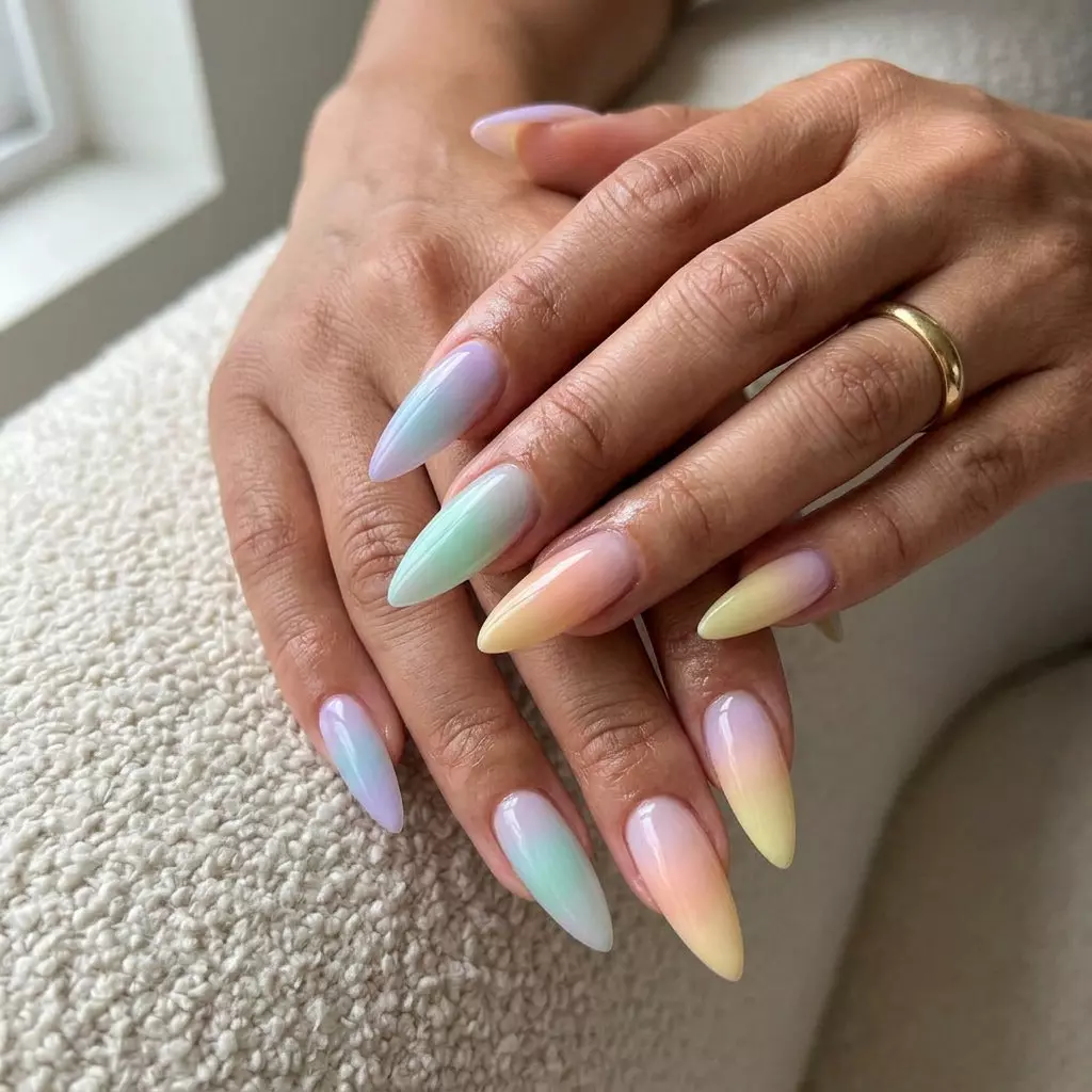 Pastel Rainbow Stiletto Fade Nails 2026 Glamorous vertical pastel rainbow stiletto fade nails for summer rainbow nails 2026. Perfect for parties and night outs.