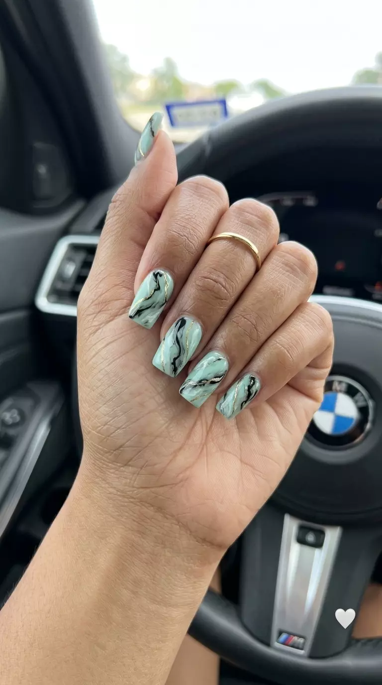 Trendy summer nails 2026: Chic mint green abstract marble nails for casual brunch.