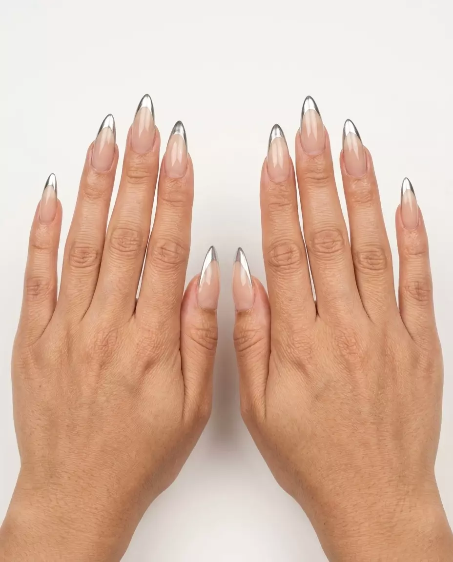 Trendy summer nails 2026: Edgy metallic silver micro French stiletto nails for a night out.